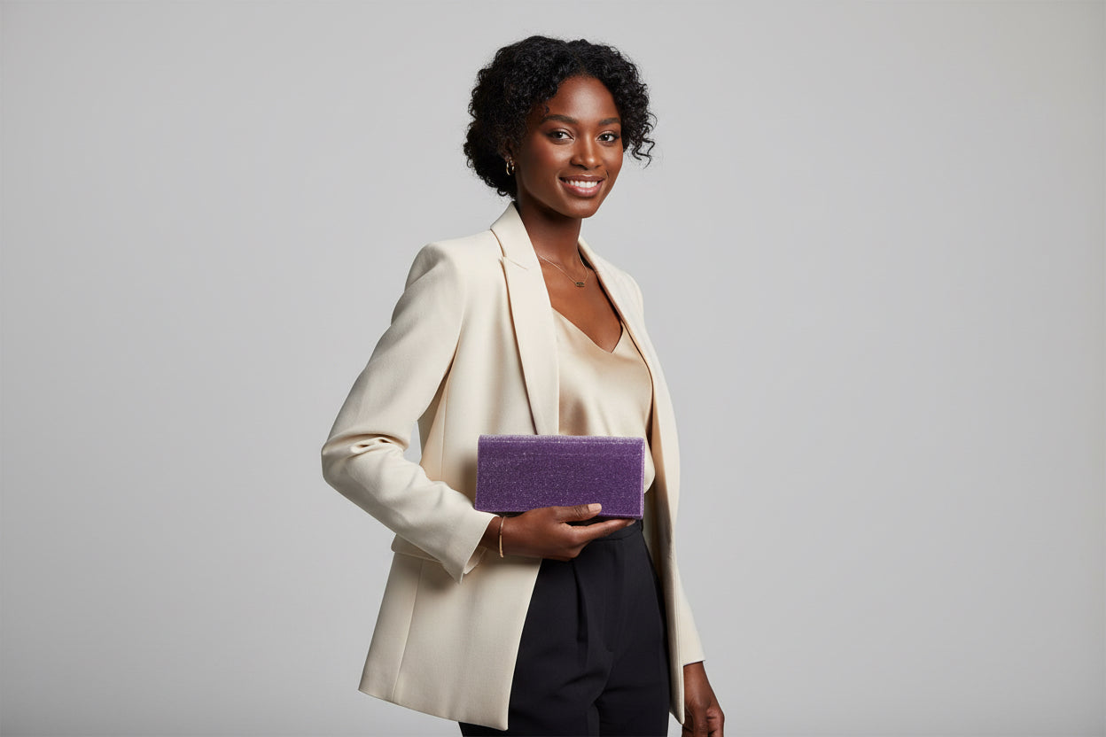 Purple glittery rectangular clutch on a white background